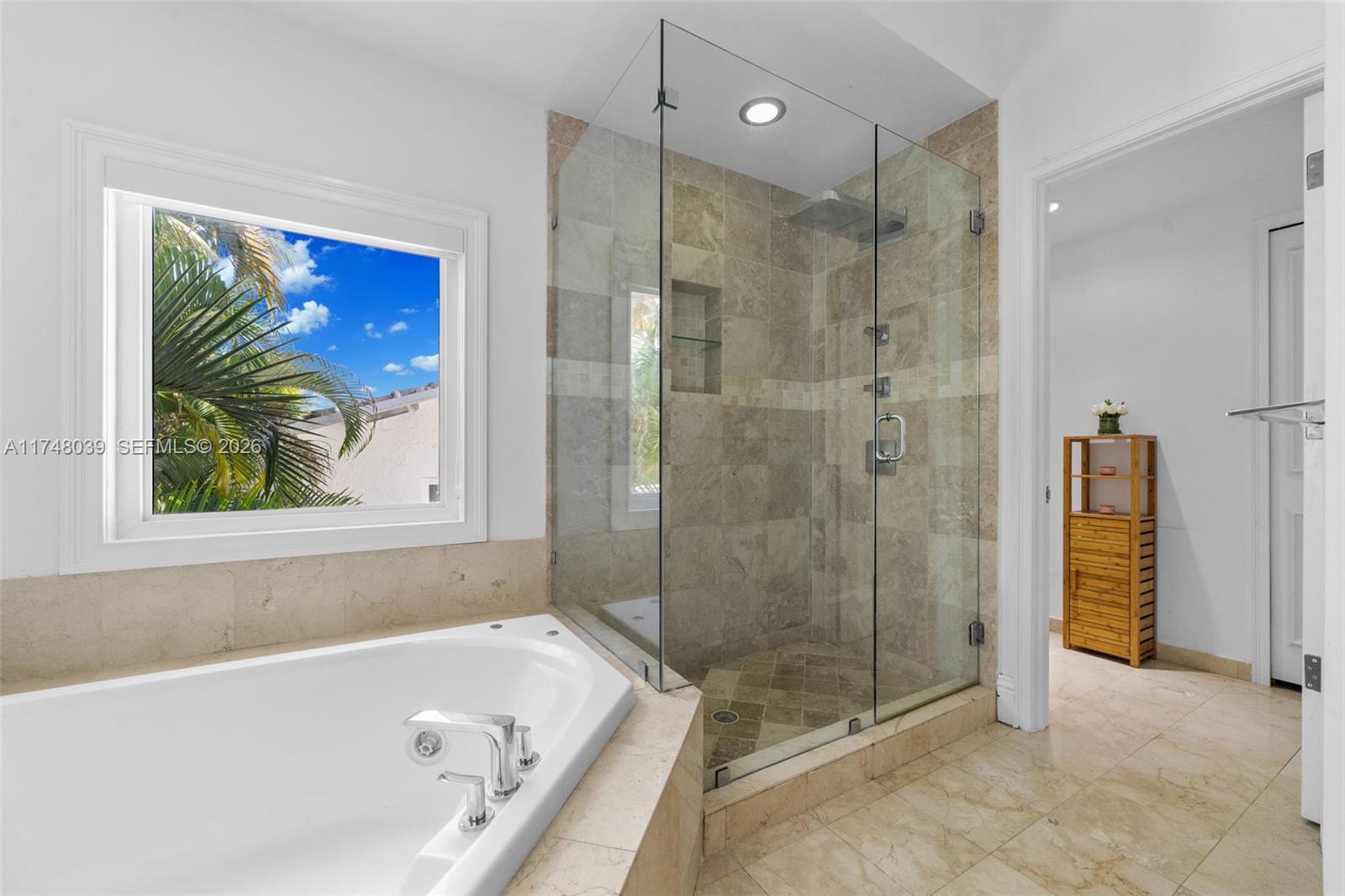 6 Coconut Lane Key Biscayne, FL 33149 - Photo 23 of 49 a bathroom with a bathtub and a shower