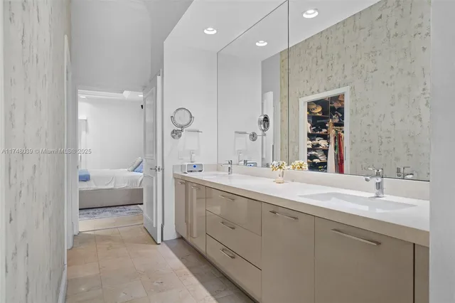 a spacious bathroom with a double vanity sink mirror double and shower