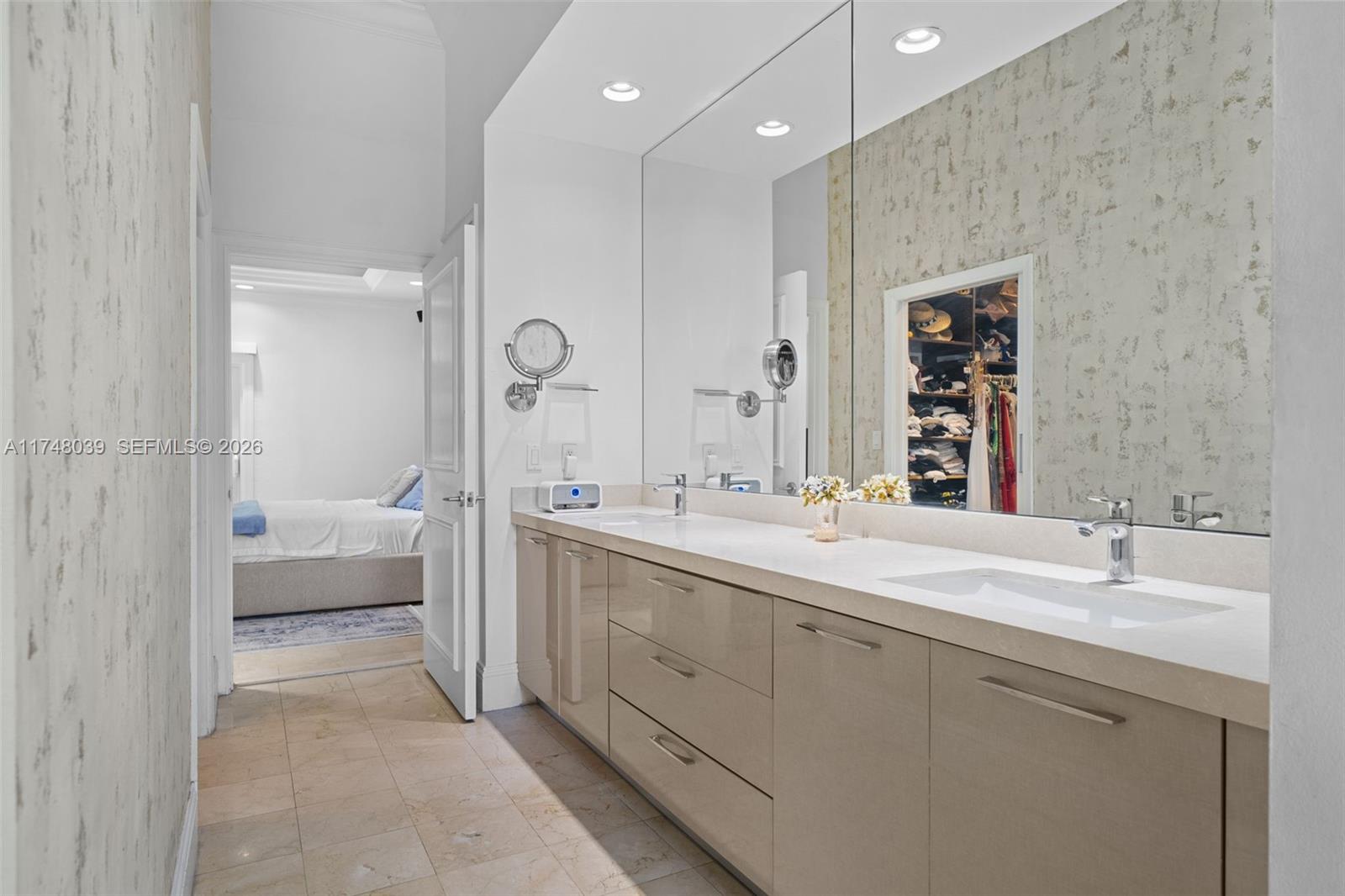 6 Coconut Lane Key Biscayne, FL 33149 - Photo 24 of 49 a spacious bathroom with a double vanity sink mirror double and shower