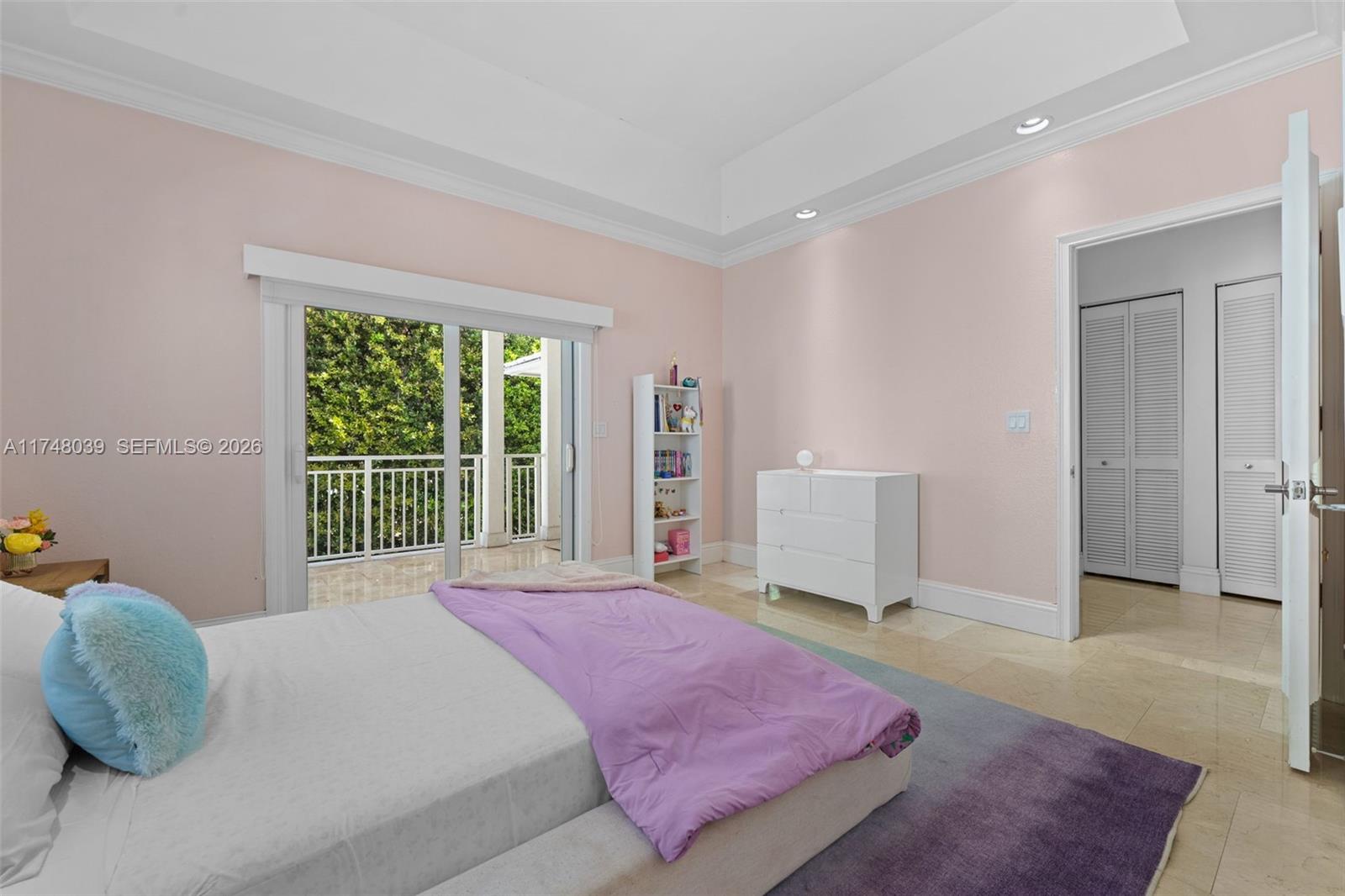 6 Coconut Lane Key Biscayne, FL 33149 - Photo 29 of 49 a bedroom with a bed and a window