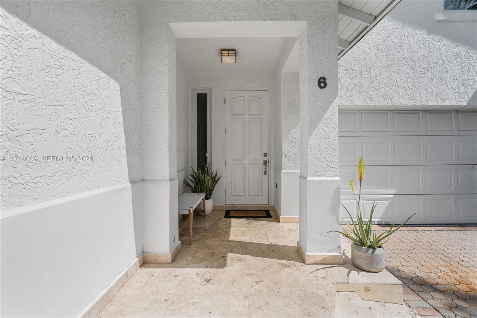 6 Coconut Lane Key Biscayne, FL 33149 - Photo 3 of 49 a view of balcony with a potted plant