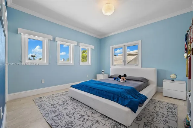 a bedroom with bed and a window