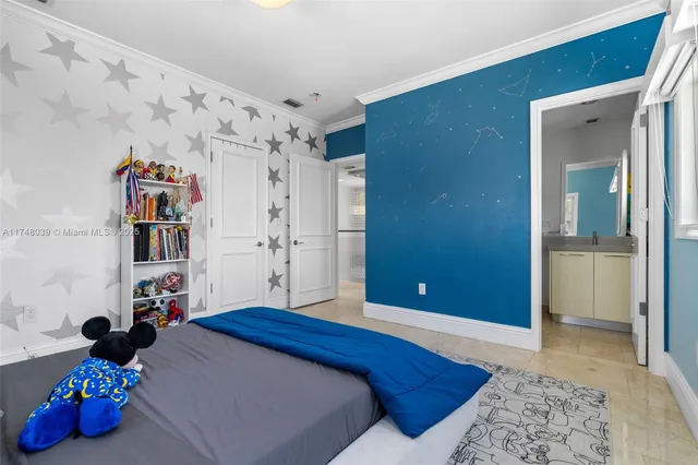 a bedroom with a bed and a walk in closet