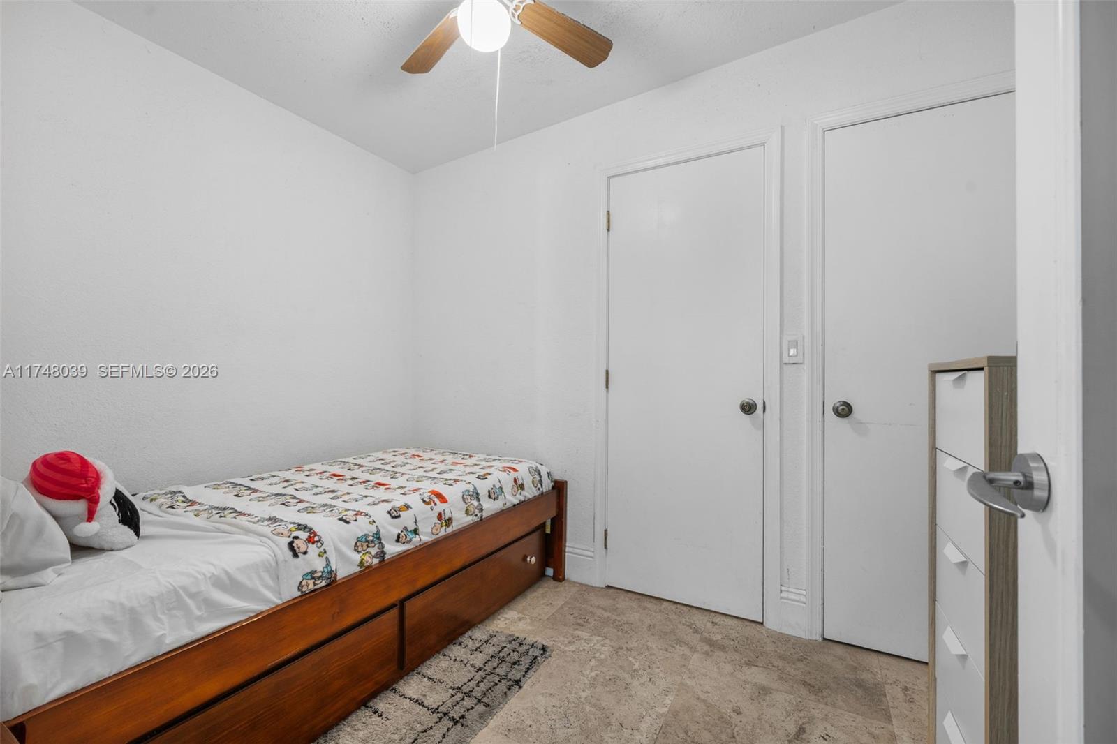 6 Coconut Lane Key Biscayne, FL 33149 - Photo 38 of 49 a bedroom with a bed and a chandelier