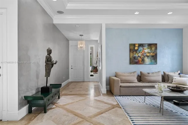 a living room with furniture a rug and a potted plant