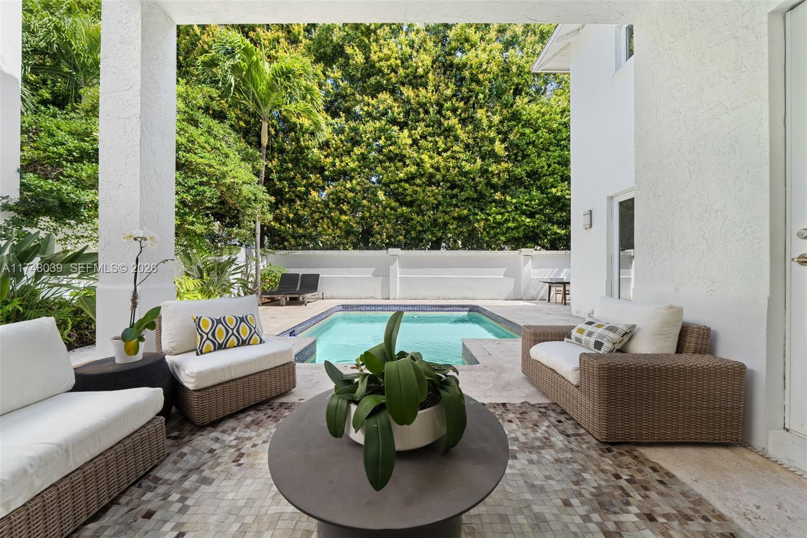6 Coconut Lane Key Biscayne, FL 33149 - Photo 42 of 49 a living room with furniture and a potted plant