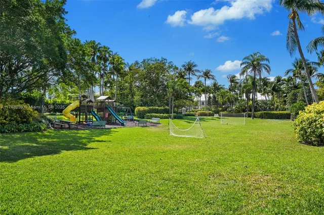 a view of a swimming pool with a yard