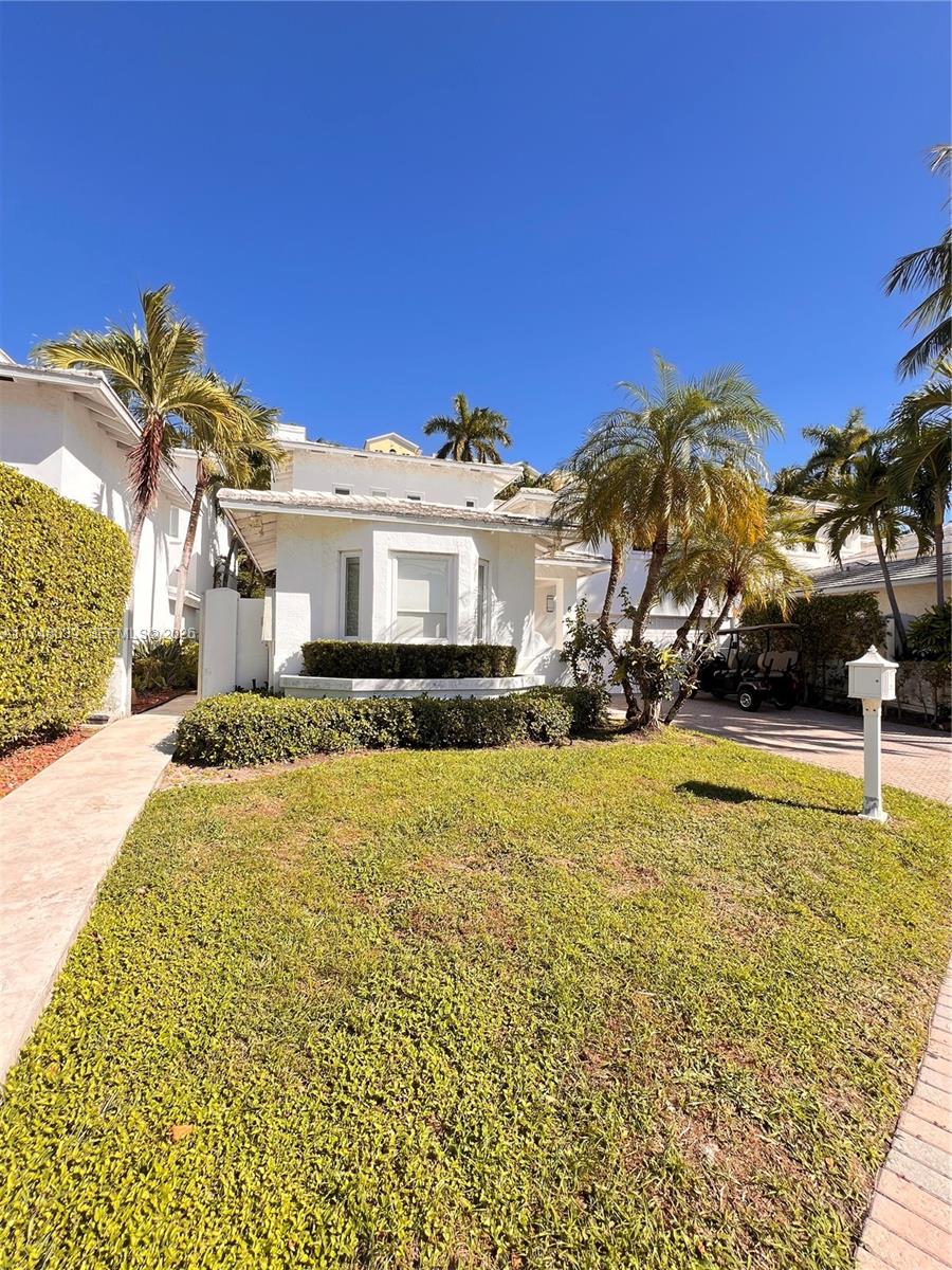 6 Coconut Lane Key Biscayne, FL 33149 - Photo 50 of 50 a view of a white house with a swimming pool