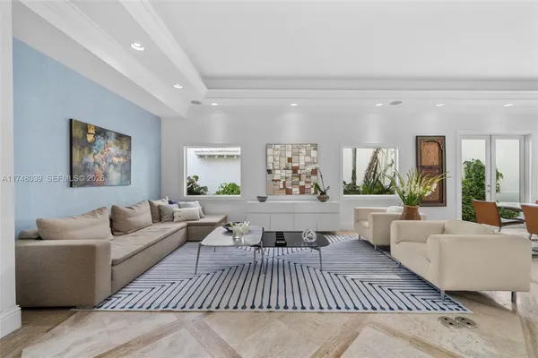 a living room with furniture and a rug
