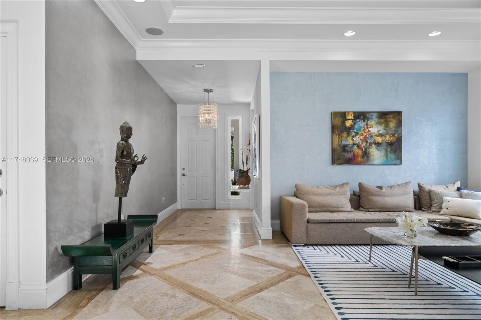 6 Coconut Lane Key Biscayne, FL 33149 - Photo 5 of 50 a living room with furniture a rug and a potted plant