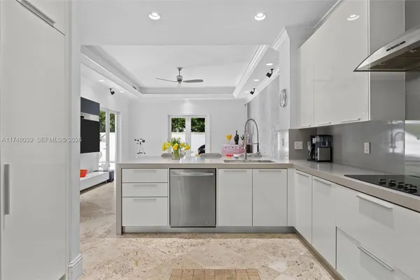 a kitchen with cabinets and window