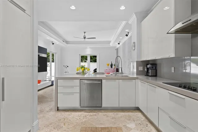 a kitchen with cabinets and window