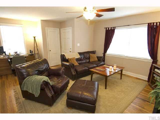 2112 Wake Forest Road Raleigh, NC 27608 - Photo 2 of 9 a living room with furniture and a large window