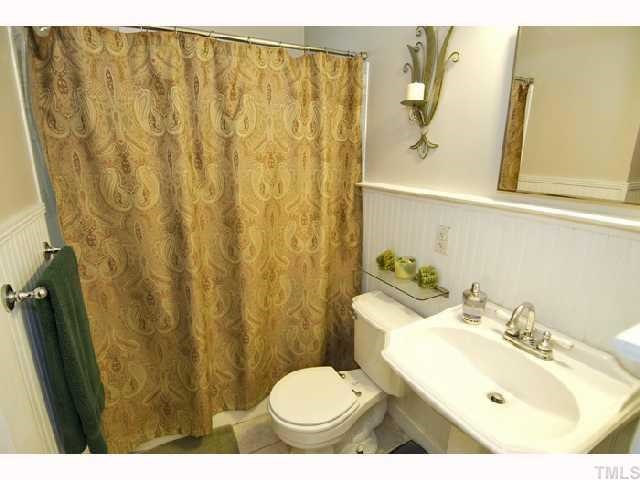 2112 Wake Forest Road Raleigh, NC 27608 - Photo 8 of 9 a bathroom with a sink and a mirror