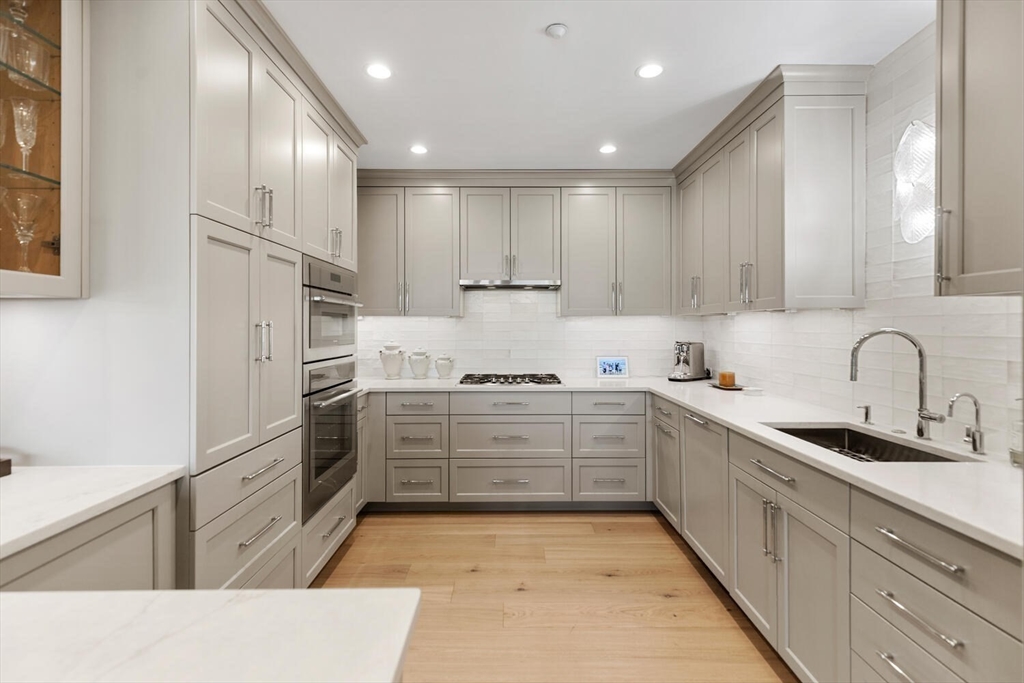 100 Belvidere Street, Unit 7A Boston, MA 02199 - Photo 12 of 40 a kitchen with refrigerator and cabinets