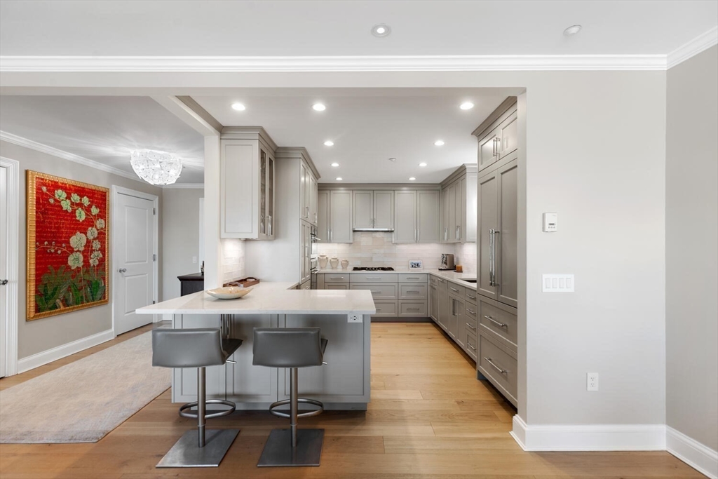100 Belvidere Street, Unit 7A Boston, MA 02199 - Photo 13 of 40 a dining hall with stainless steel appliances kitchen island granite countertop a dining table chairs and view living room