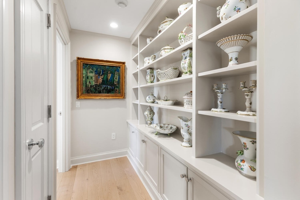 100 Belvidere Street, Unit 7A Boston, MA 02199 - Photo 19 of 40 a hallway with white cabinets