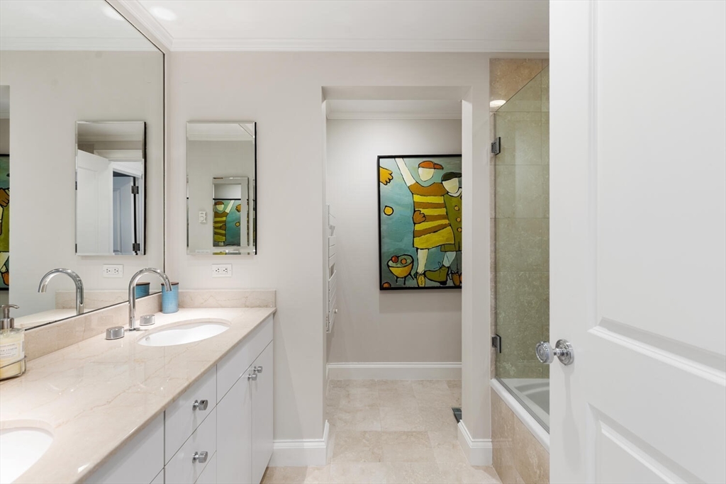 100 Belvidere Street, Unit 7A Boston, MA 02199 - Photo 27 of 40 a bathroom with a sink and a mirror