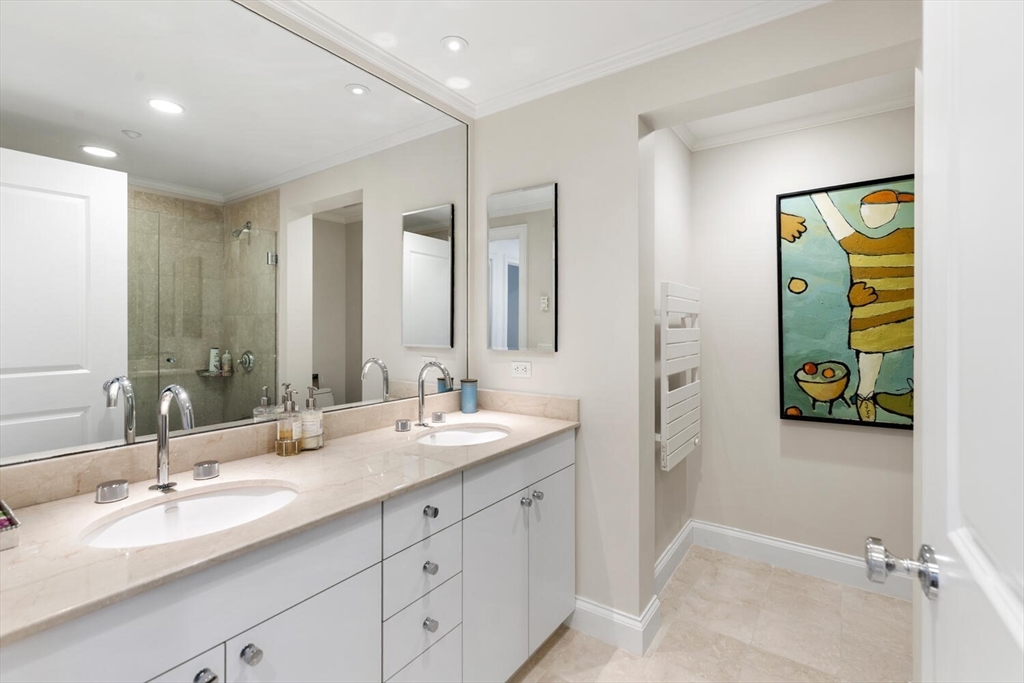 100 Belvidere Street, Unit 7A Boston, MA 02199 - Photo 28 of 40 a bathroom with a sink and a mirror