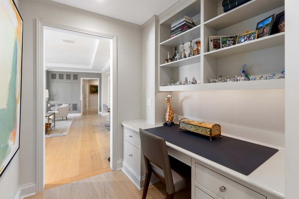 100 Belvidere Street, Unit 7A Boston, MA 02199 - Photo 30 of 40 a workspace with furniture and book shelf