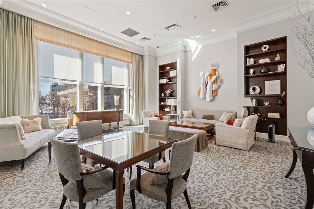 100 Belvidere Street, Unit 7A Boston, MA 02199 - Photo 33 of 40 a living room with furniture and large windows