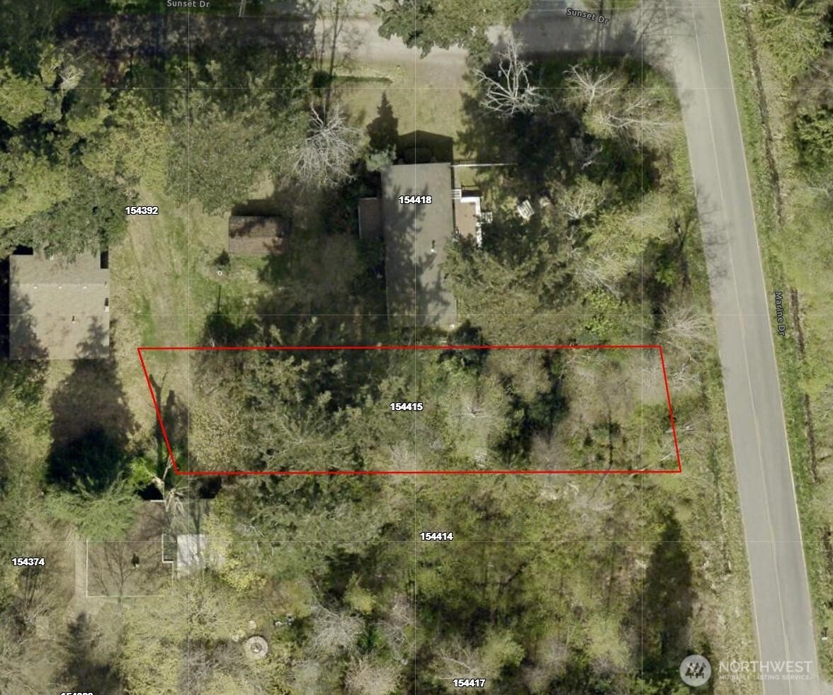 0 Marine Drive Point Roberts, WA 98281 - Photo 3 of 4 a view of a yard with plants and brick wall