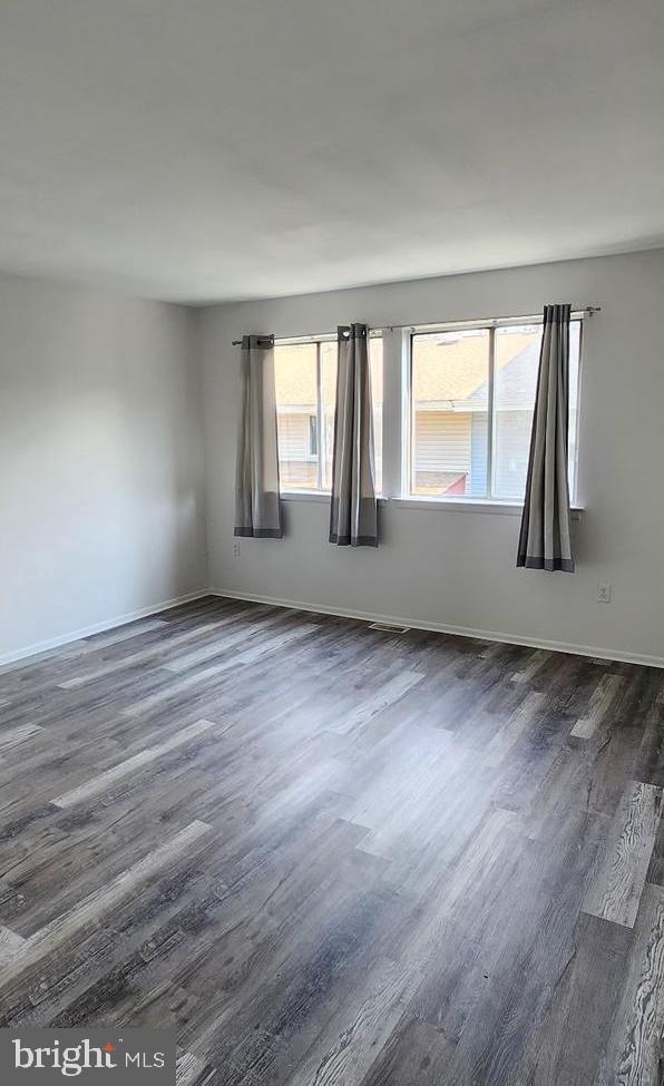 736 Myrtle Avenue Lindenwold, NJ 08021 - Photo 12 of 31 an empty room with wooden floor and windows