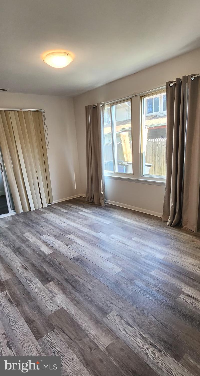 736 Myrtle Avenue Lindenwold, NJ 08021 - Photo 19 of 31 a view of an empty room with wooden floor and a window