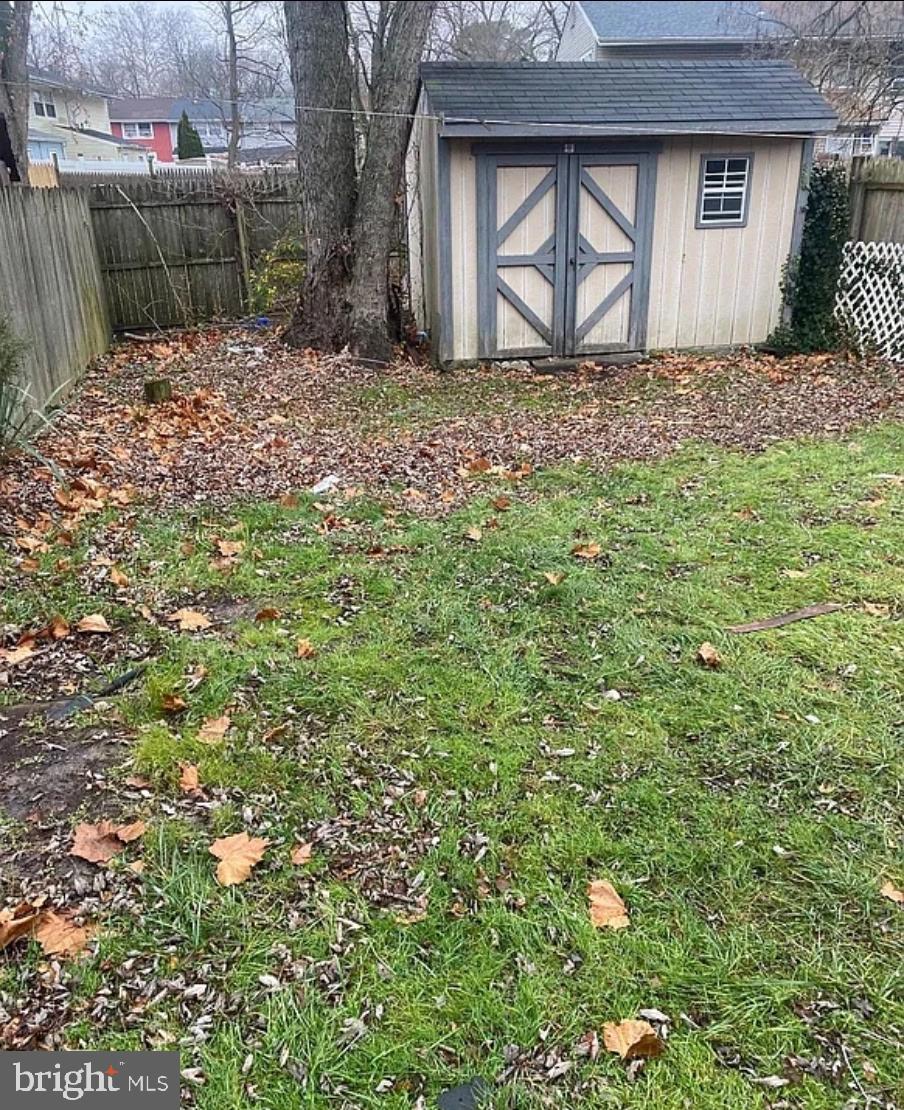 736 Myrtle Avenue Lindenwold, NJ 08021 - Photo 31 of 31 a backyard of a house with a yard and garage