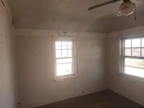 an empty room with windows