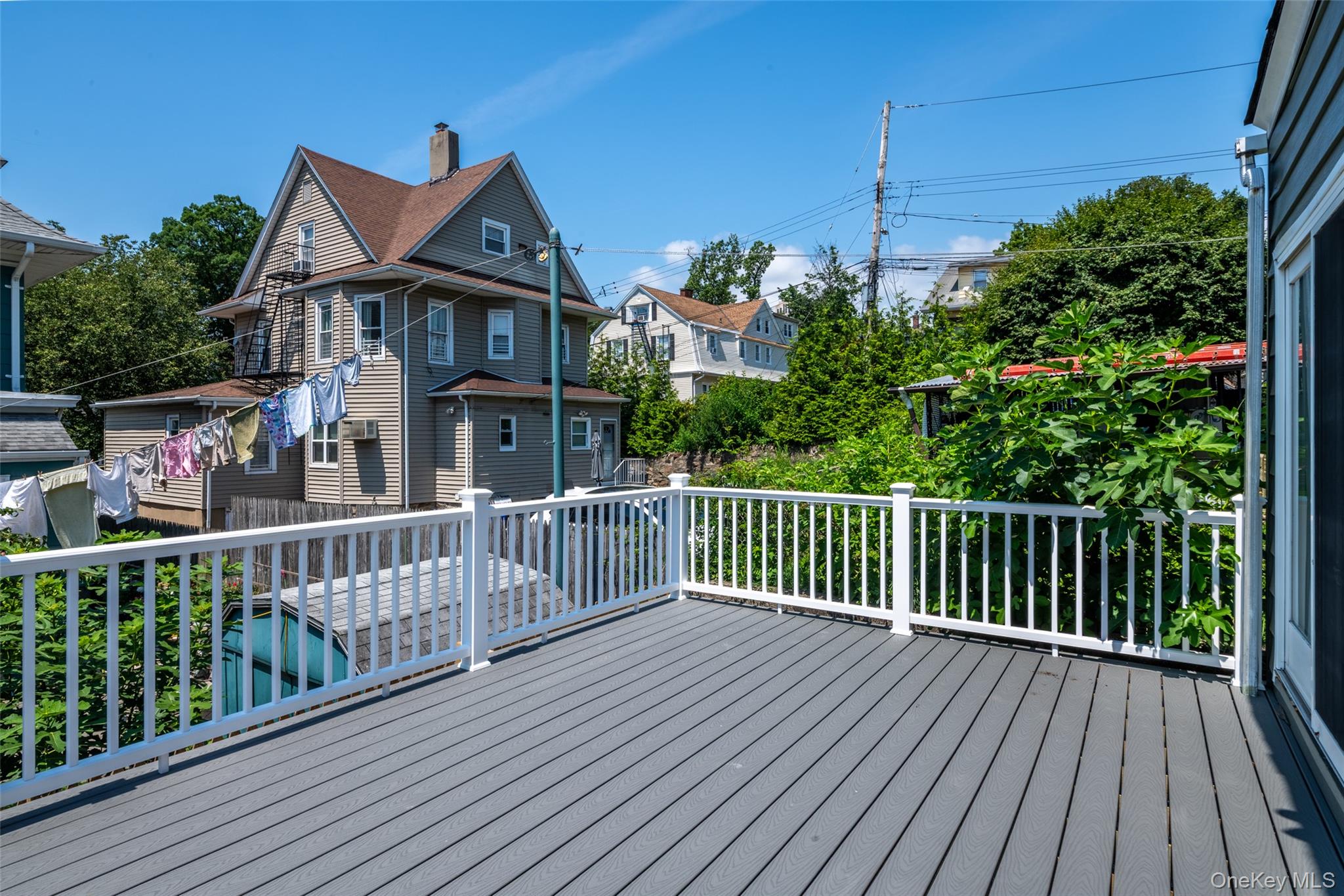 7 Alpha Place, Unit FIRST New Rochelle, NY 10805 - Photo 5 of 25 Wooden deck featuring a residential view
