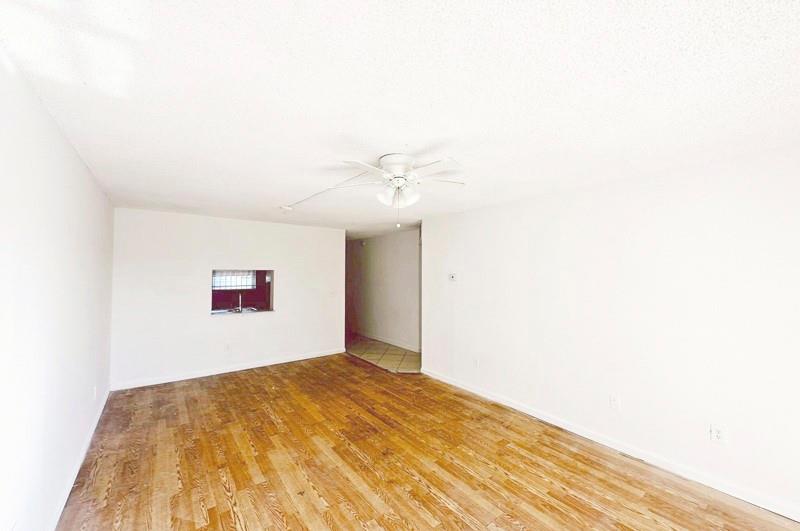 2800 Northwest 56th Avenue, Unit G407 Lauderhill, FL 33313 - Photo 13 of 15 a view of a big room with wooden floor