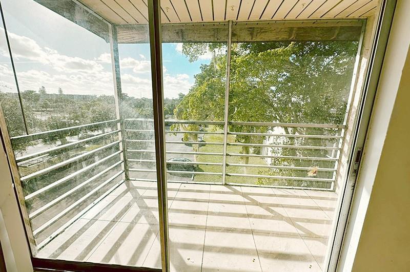 2800 Northwest 56th Avenue, Unit G407 Lauderhill, FL 33313 - Photo 15 of 15 a view of a glass door with a glass door
