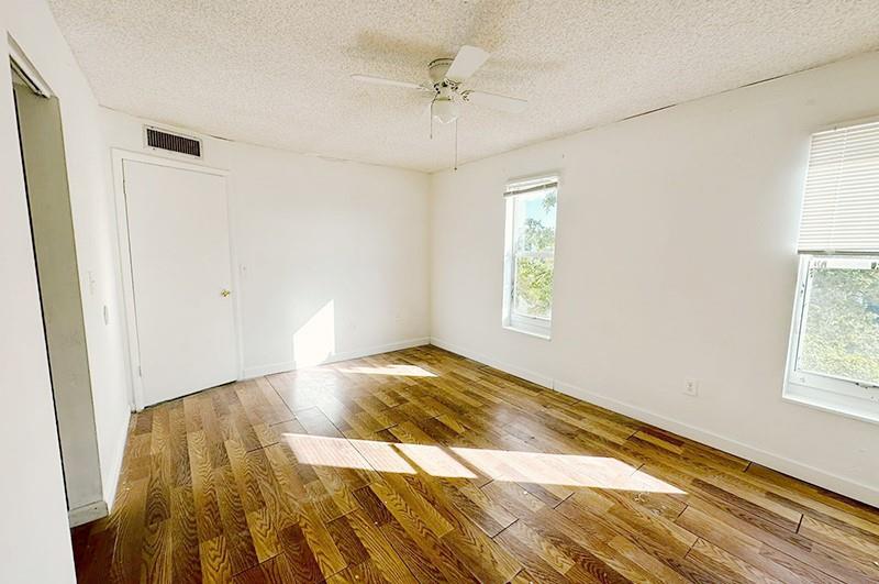 2800 Northwest 56th Avenue, Unit G407 Lauderhill, FL 33313 - Photo 9 of 15 a bedroom with a bed and a window