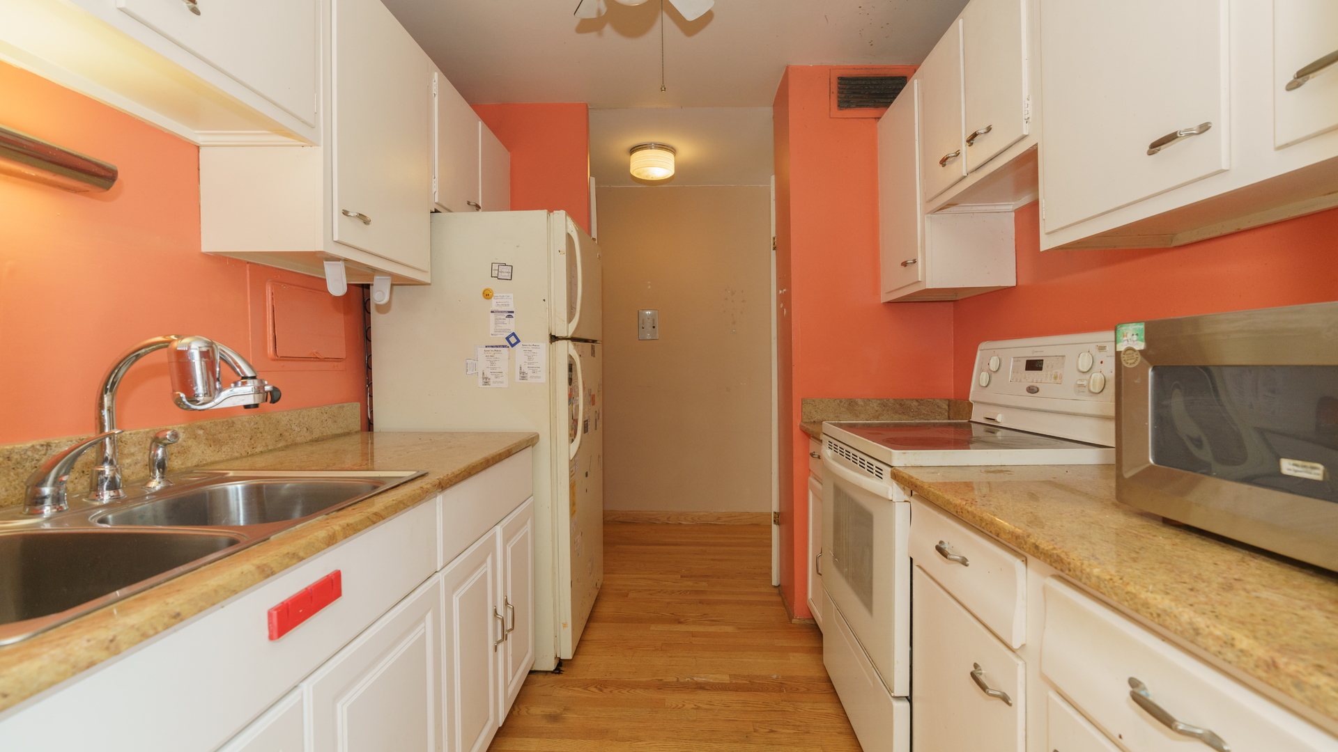 5740 North Sheridan Road, Unit 10D Chicago, IL 60660 - Photo 13 of 22 a kitchen with stainless steel appliances granite countertop a sink and dishwasher