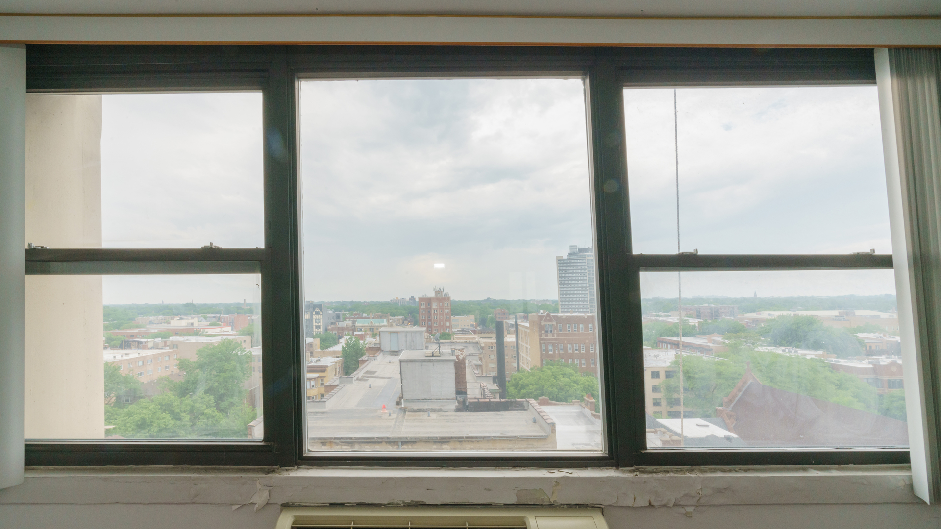 5740 North Sheridan Road, Unit 10D Chicago, IL 60660 - Photo 17 of 22 a view of a glass door with a from a window
