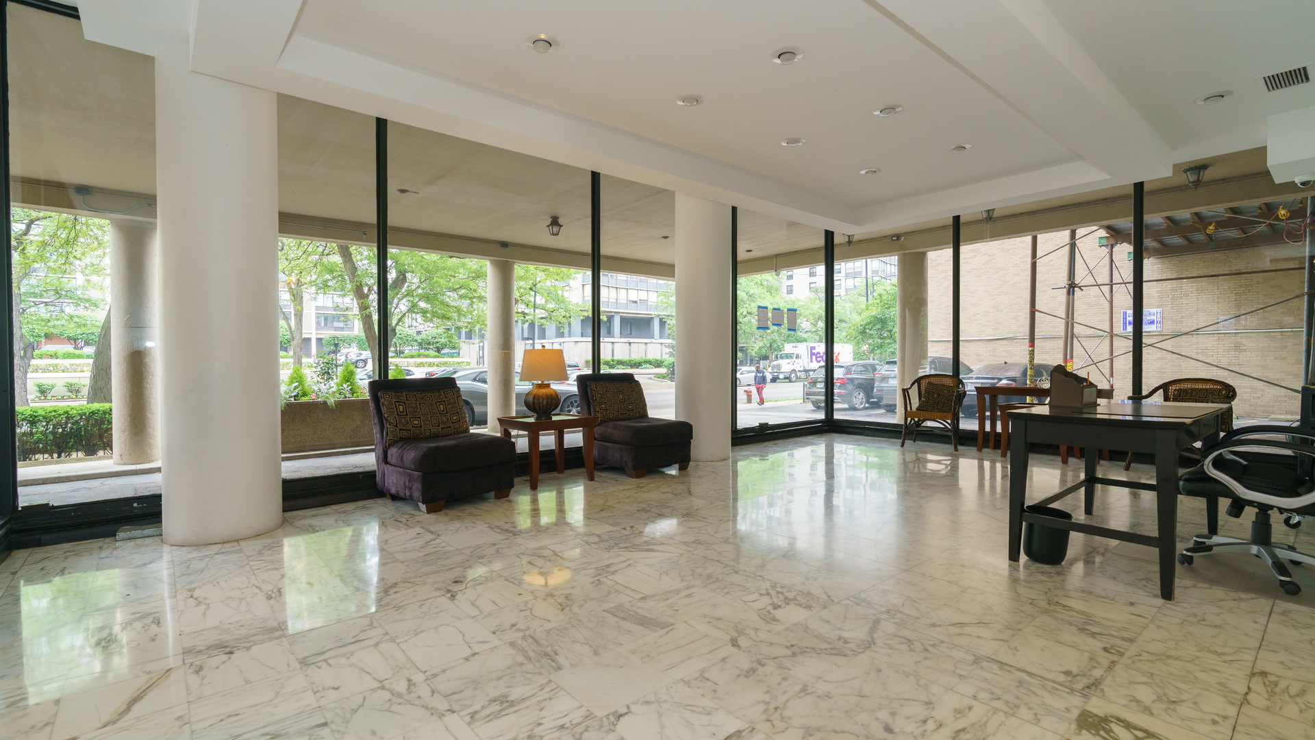 5740 North Sheridan Road, Unit 10D Chicago, IL 60660 - Photo 3 of 22 a living room with furniture and a large window