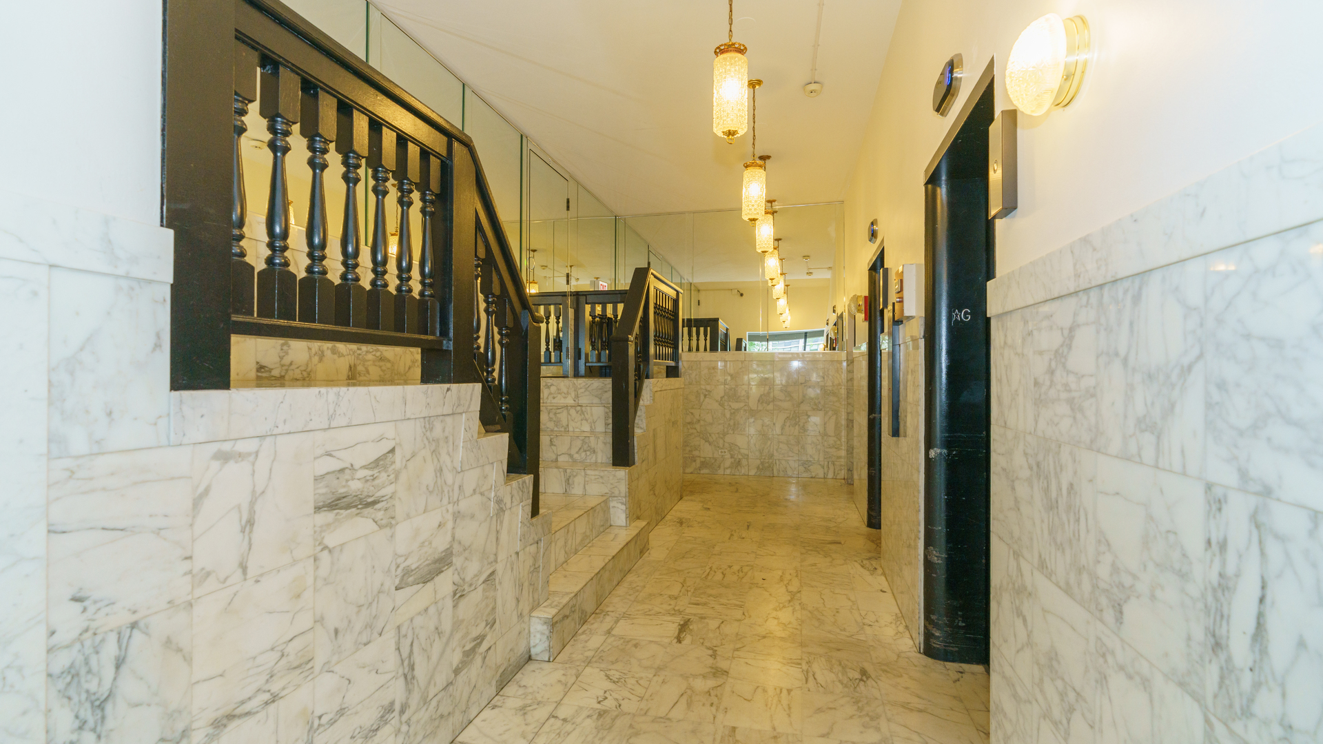 5740 North Sheridan Road, Unit 10D Chicago, IL 60660 - Photo 5 of 22 a view of staircase with a glass door shower