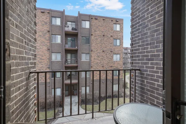 a view of a brick building from a balcony
