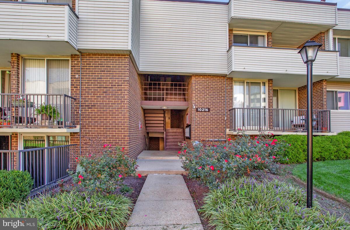10216 Prince Place, Unit 9204 Upper Marlboro, MD 20774 - Photo 4 of 19 a front view of a house having outdoor seating