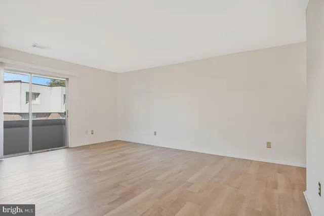 a view of a livingroom with wooden floor