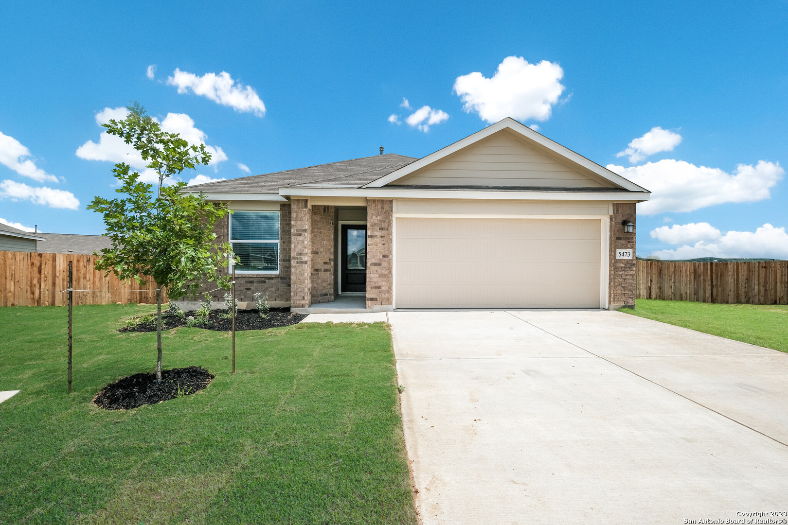 9928 Dicket Mead Road San Antonio, TX 78254 - Photo 1 of 1 a front view of a house with a yard