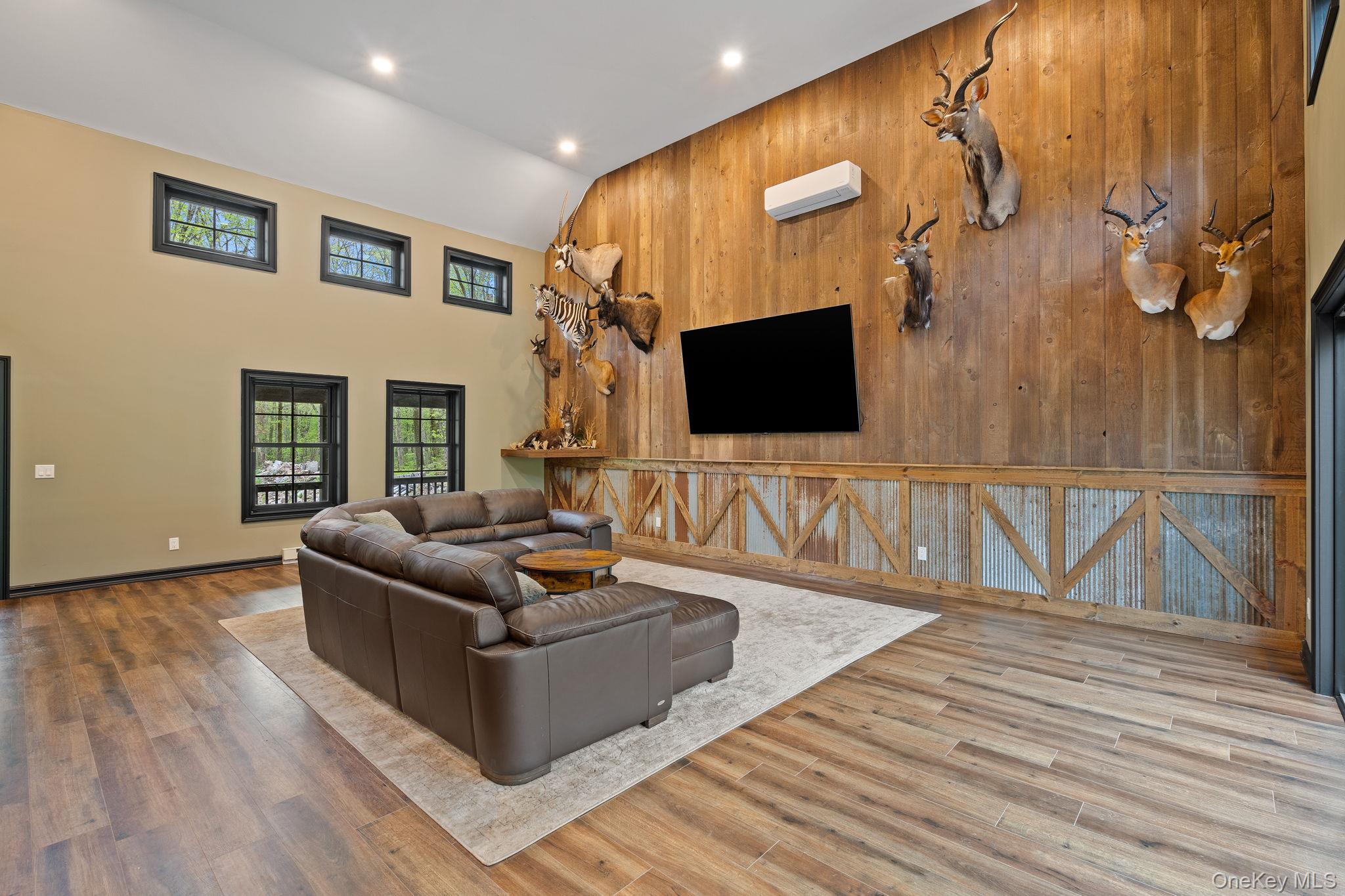 660 South Plank Road Newburgh, NY 12550 - Photo 11 of 50 a living room with furniture and a flat screen tv