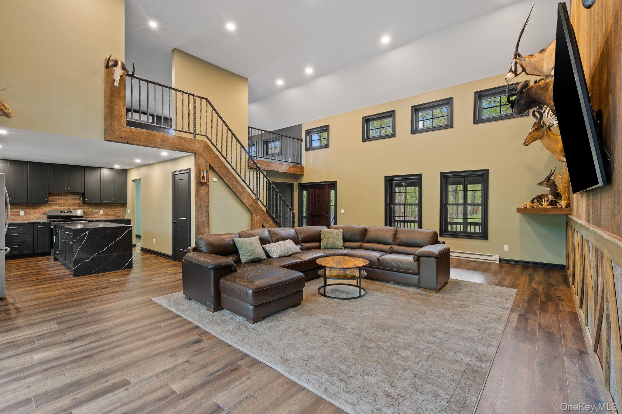 660 South Plank Road Newburgh, NY 12550 - Photo 12 of 50 a living room with fireplace furniture and a flat screen tv