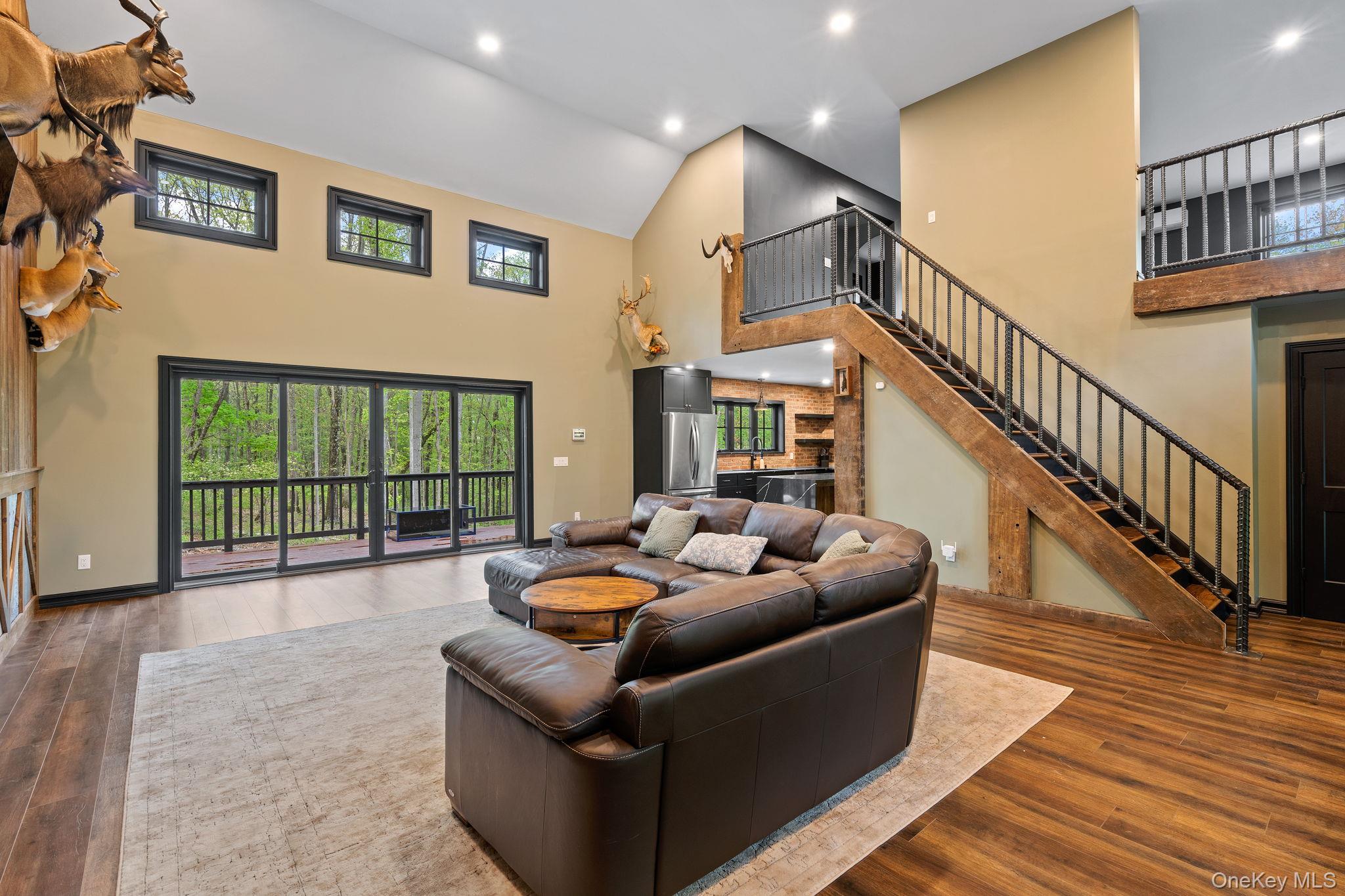 660 South Plank Road Newburgh, NY 12550 - Photo 13 of 50 a living room with furniture floor to ceiling window and wooden floor