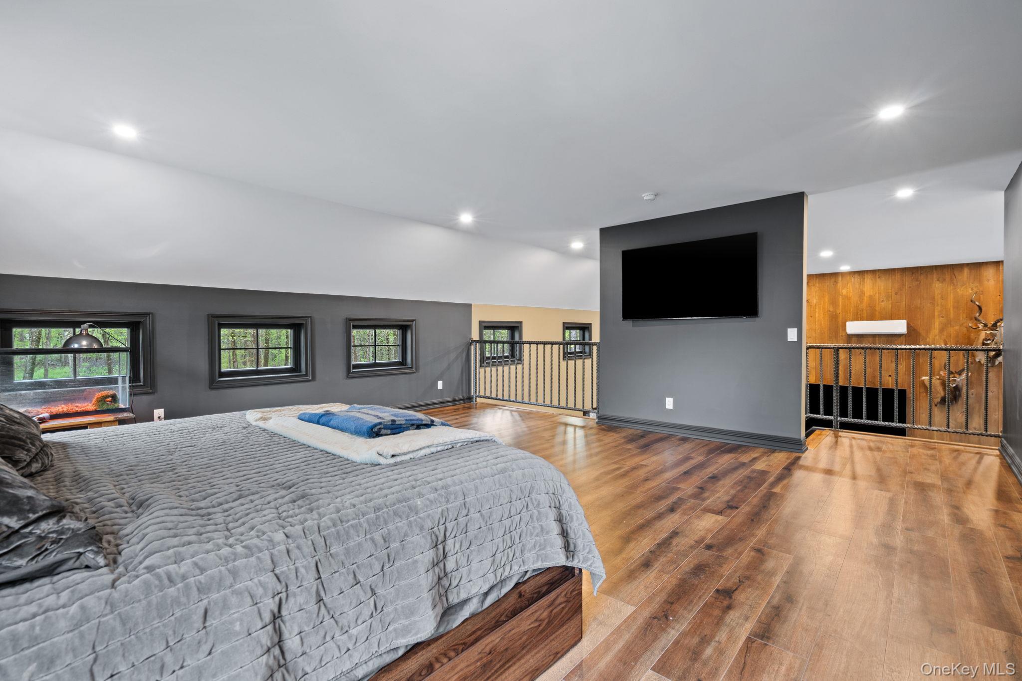 660 South Plank Road Newburgh, NY 12550 - Photo 16 of 50 a bedroom with a bed and a flat screen tv