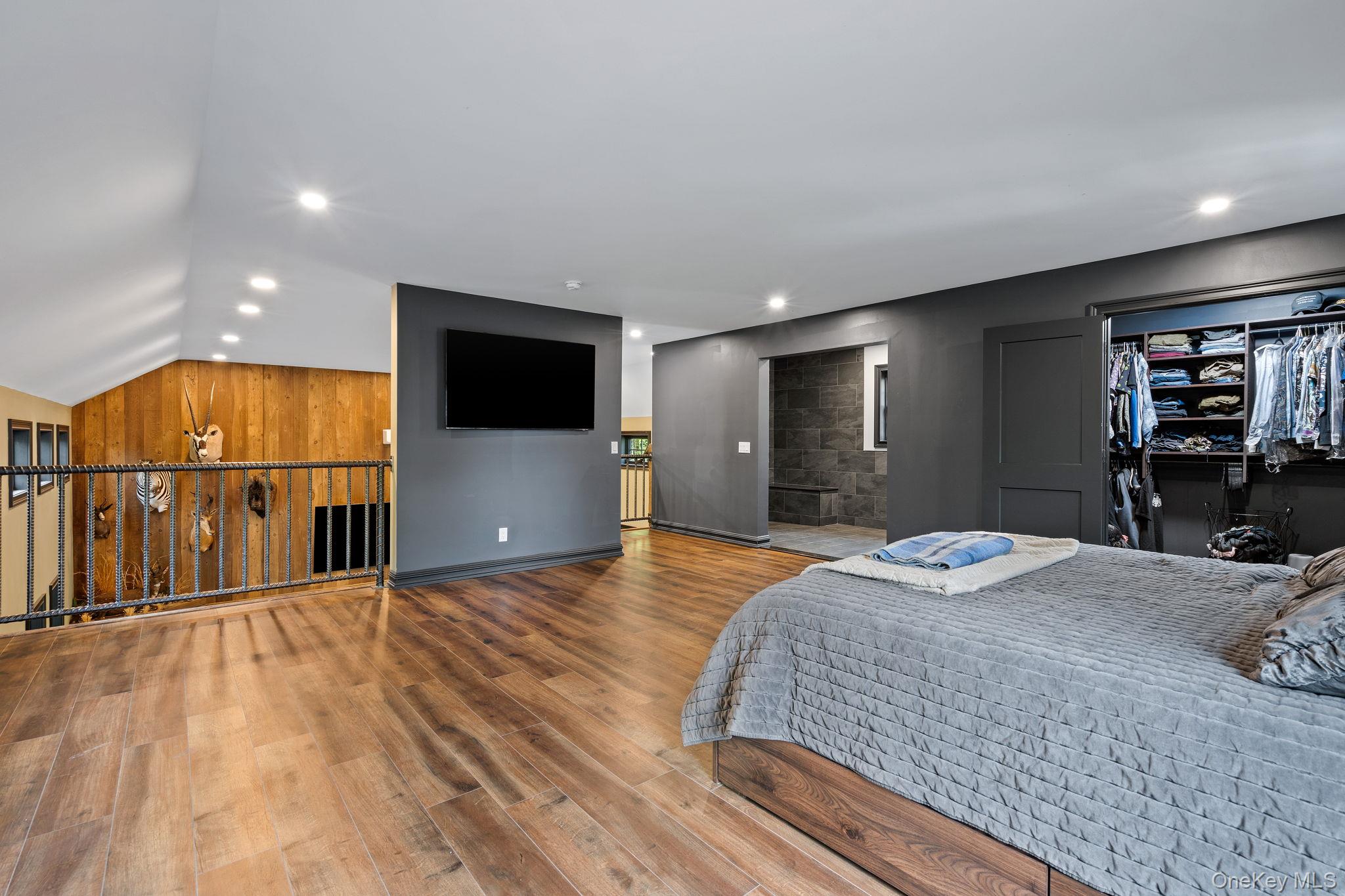 660 South Plank Road Newburgh, NY 12550 - Photo 17 of 50 a bed room with a bed and a television