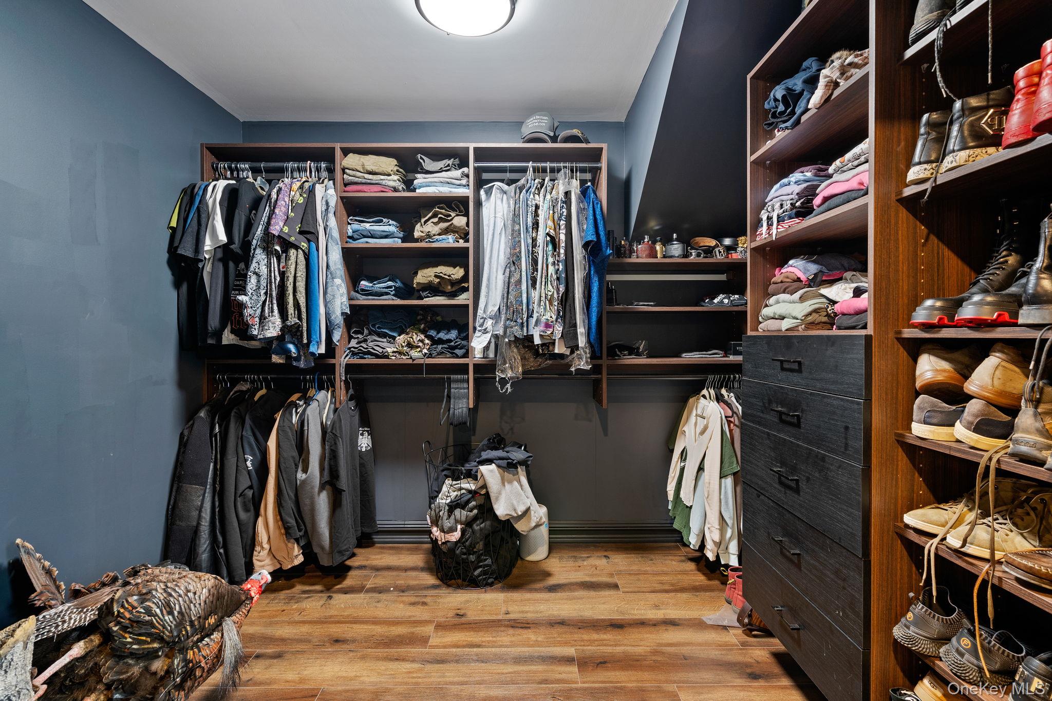 660 South Plank Road Newburgh, NY 12550 - Photo 18 of 50 a view of walk in closet with clothes and shoes