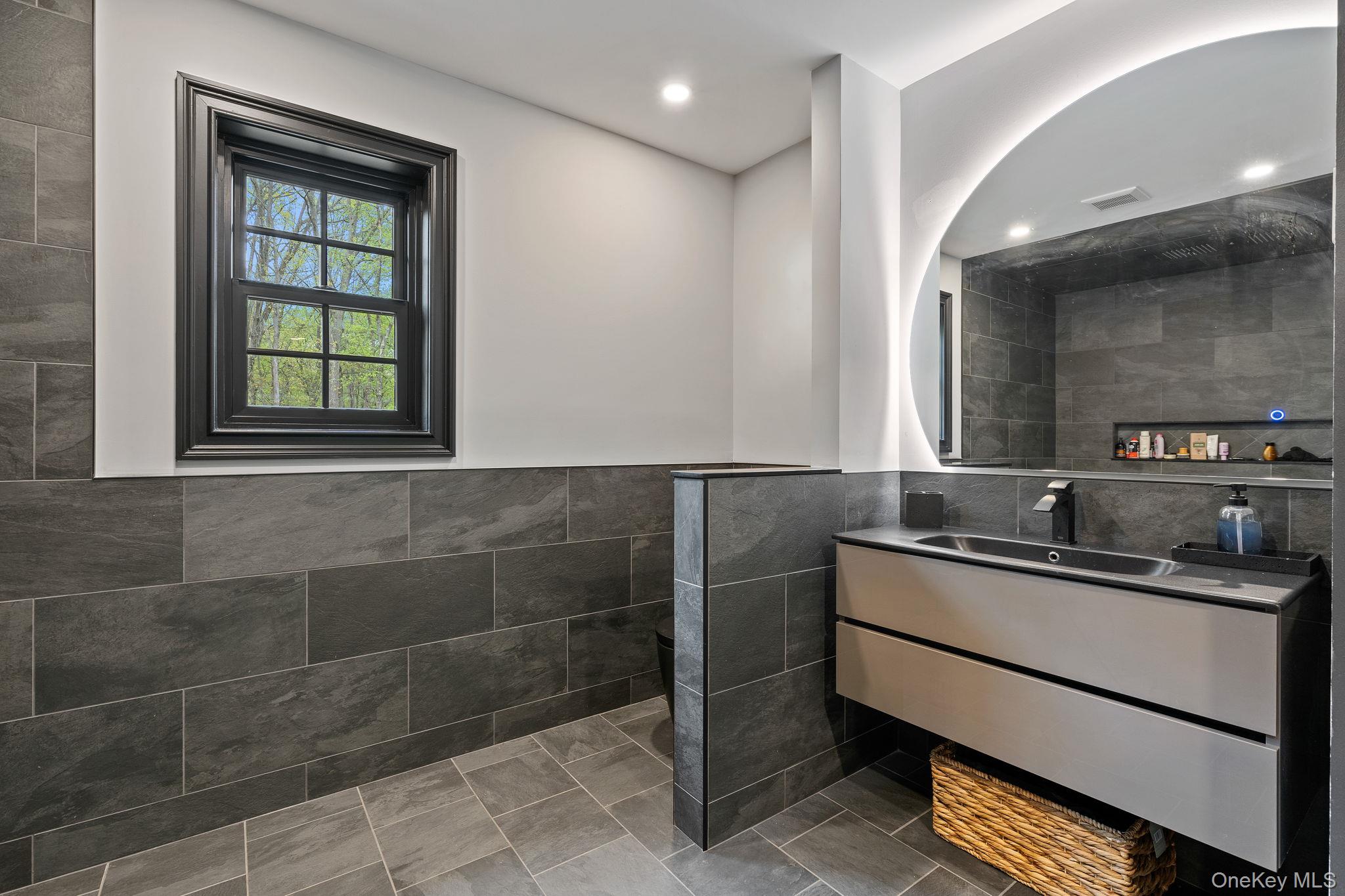 660 South Plank Road Newburgh, NY 12550 - Photo 21 of 50 a bathroom with a sink and a mirror