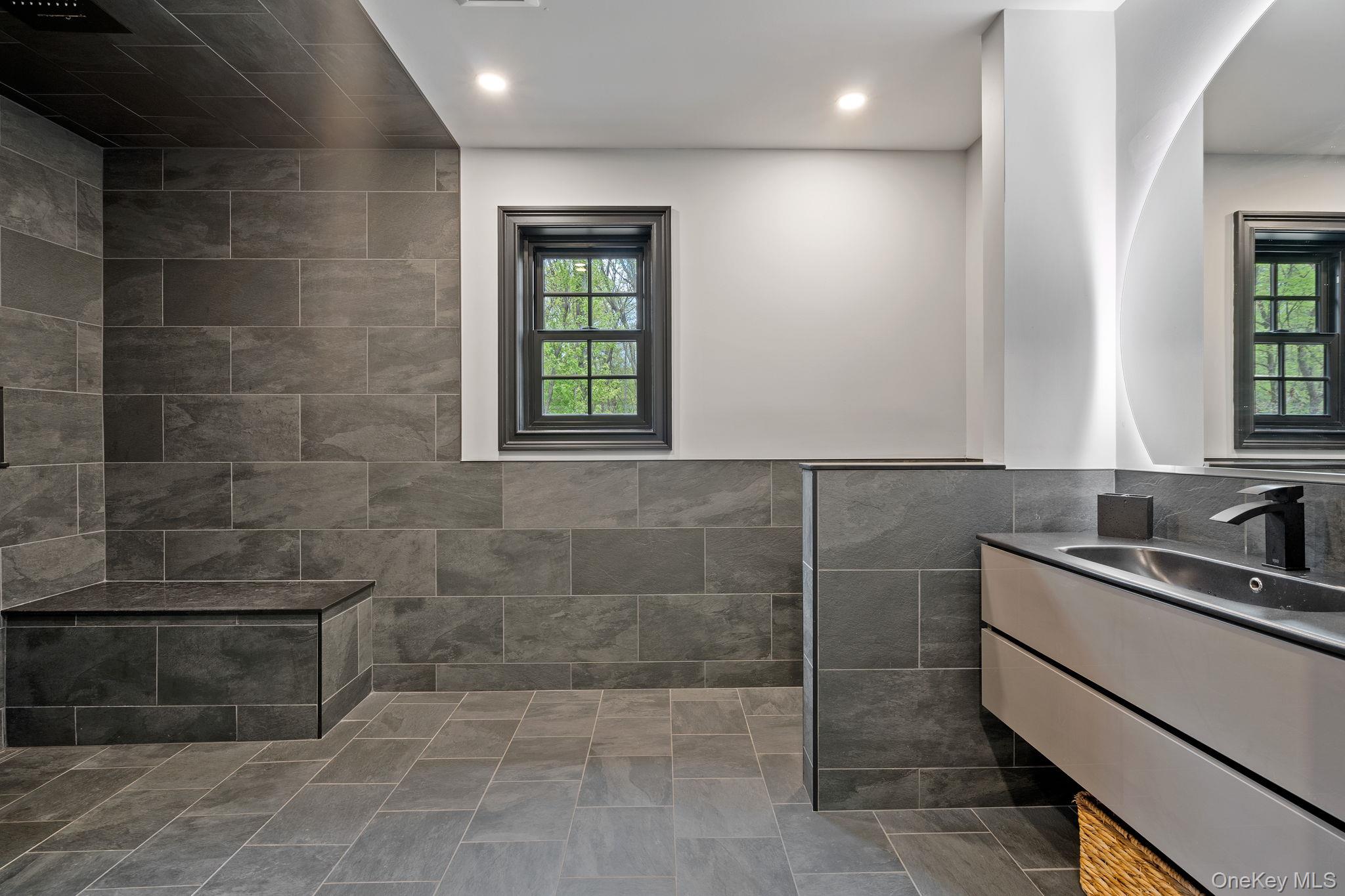660 South Plank Road Newburgh, NY 12550 - Photo 22 of 50 a bathroom with a sink a toilet and window